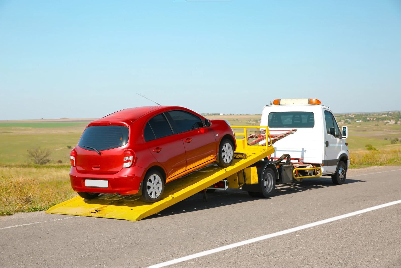 FSR Recovery Groups tow truck loading a vehicle